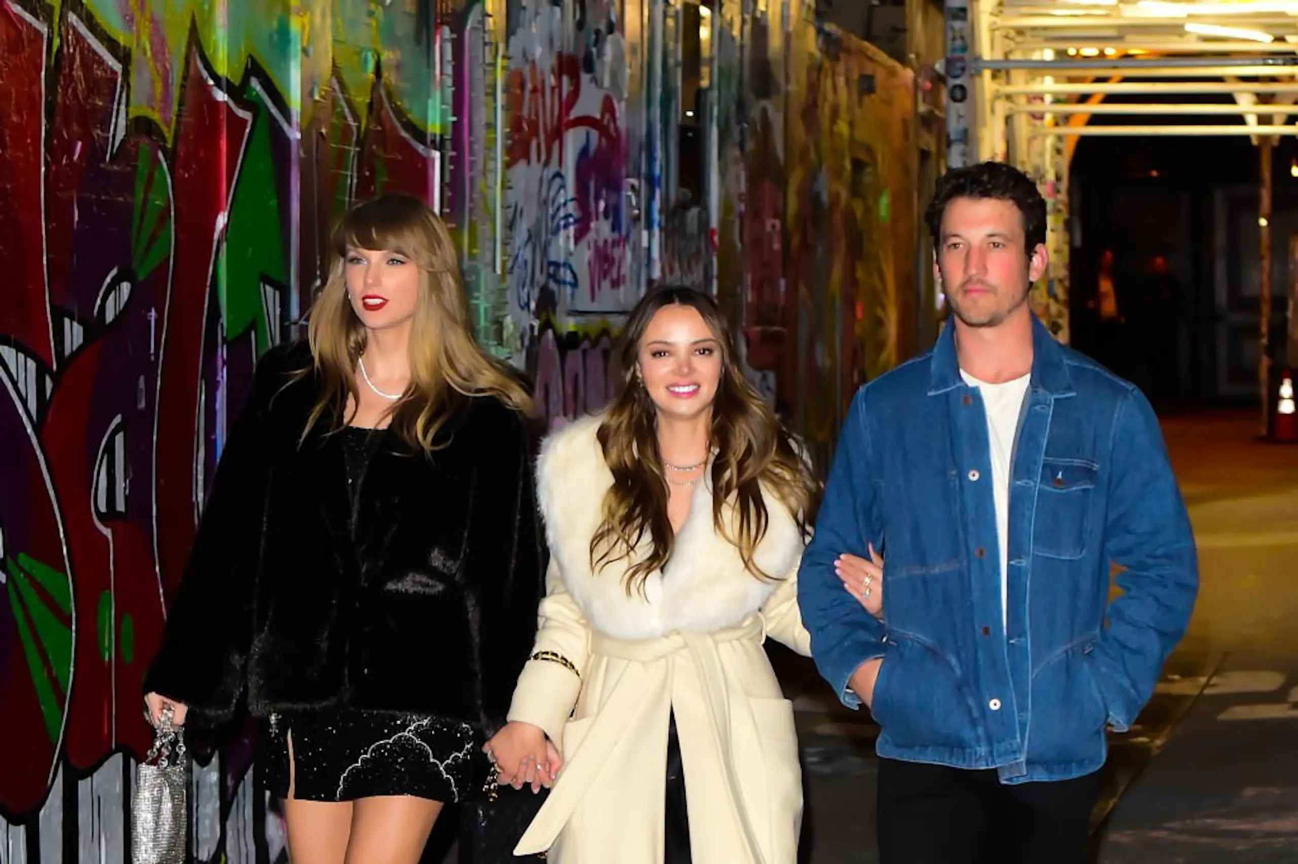 Taylor Swift with Keleigh Teller and Miles Teller on December 13, 2023, in New York City. Credit: Raymond Hall / Getty