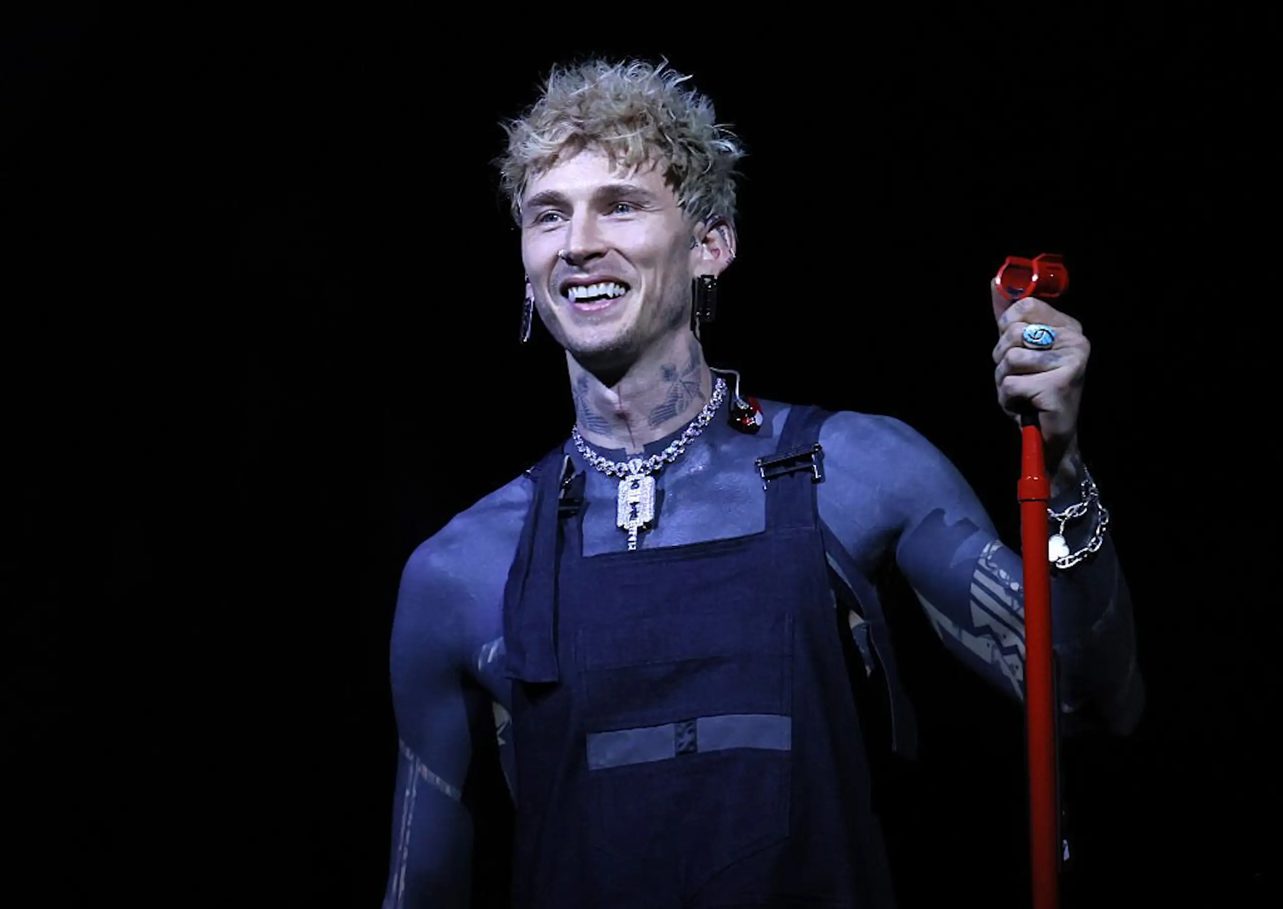 Machine Gun Kelly spoke about the terrifying side effects of his "near impossible" blackout tattoos. Credit: Chiaki Nozu / Getty
